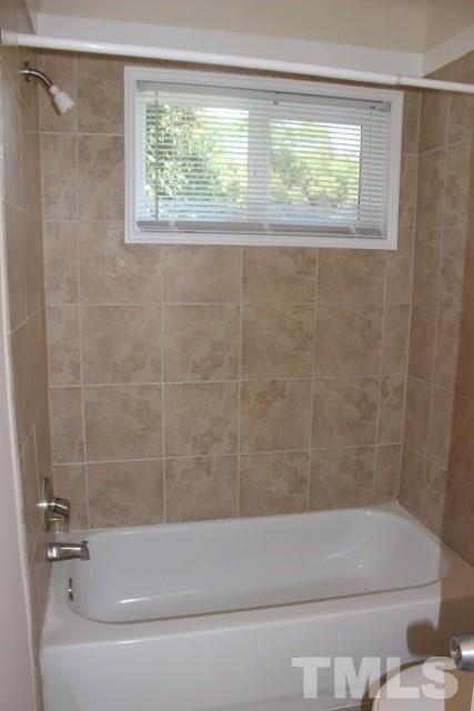 800 Friar Tuck Road Raleigh, NC 27610 - Photo 17 of 18 a bathroom with a shower and a bathtub