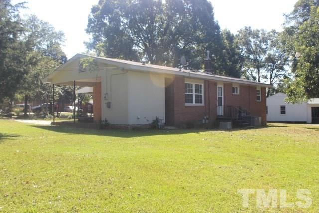 800 Friar Tuck Road Raleigh, NC 27610 - Photo 18 of 18 a front view of house with yard and trees in the background