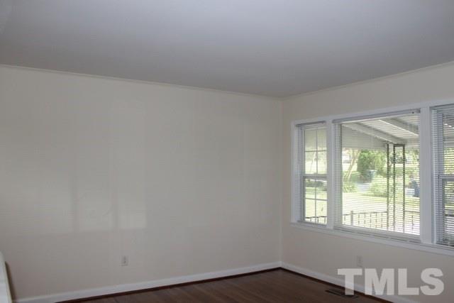 800 Friar Tuck Road Raleigh, NC 27610 - Photo 5 of 18 an empty room with a window