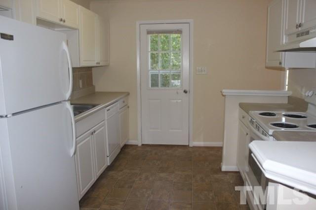 800 Friar Tuck Road Raleigh, NC 27610 - Photo 9 of 18 a kitchen that has a sink and a stove in it