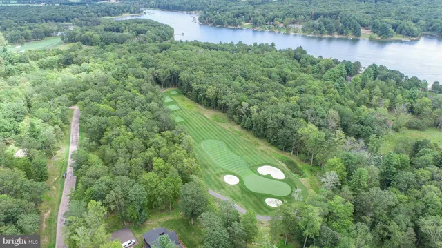 a view of a lake with a yard
