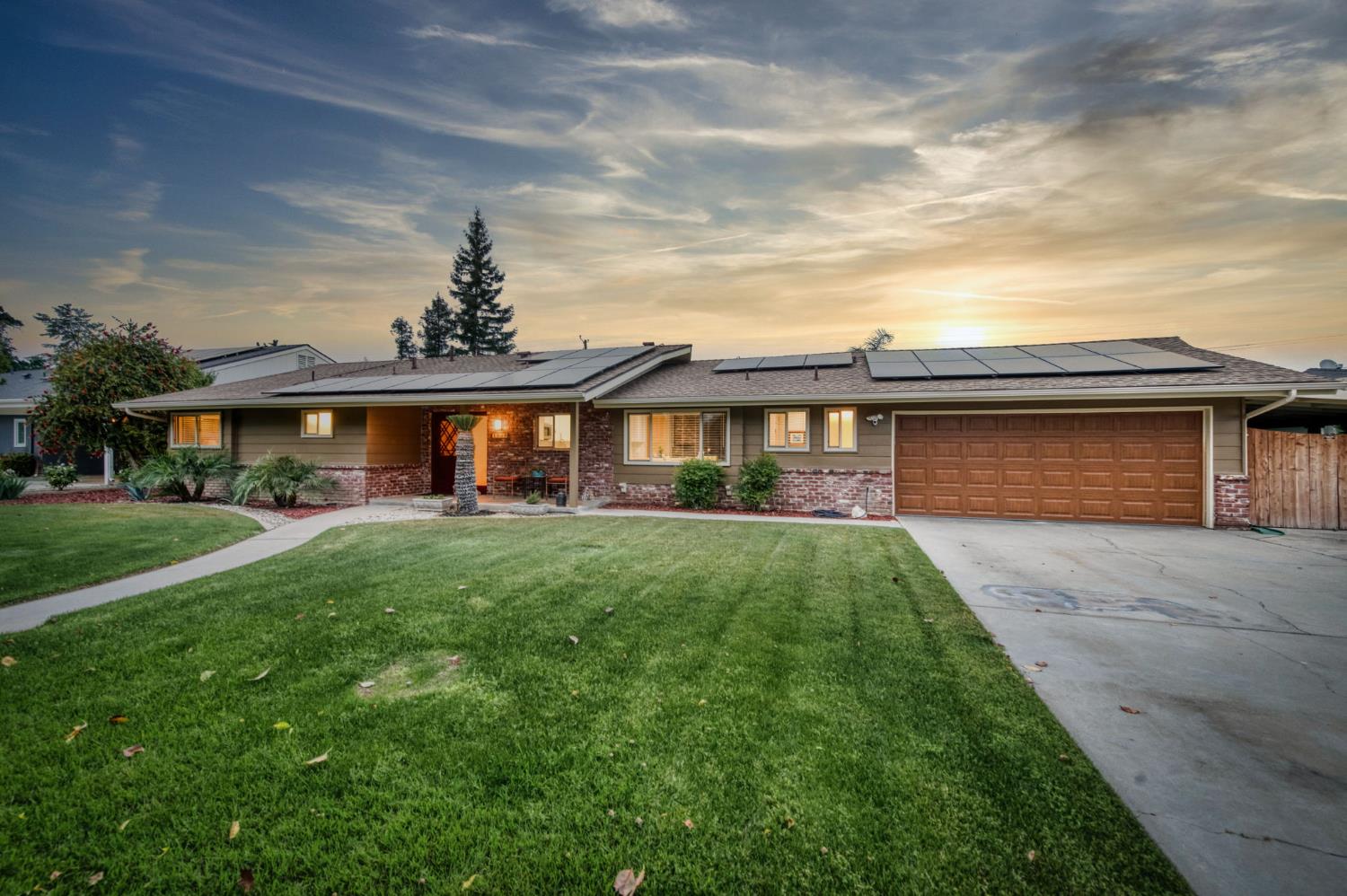 1540 West San Ramon Avenue Fresno, CA 93711 - Photo 1 of 32 front view of a house with a yard