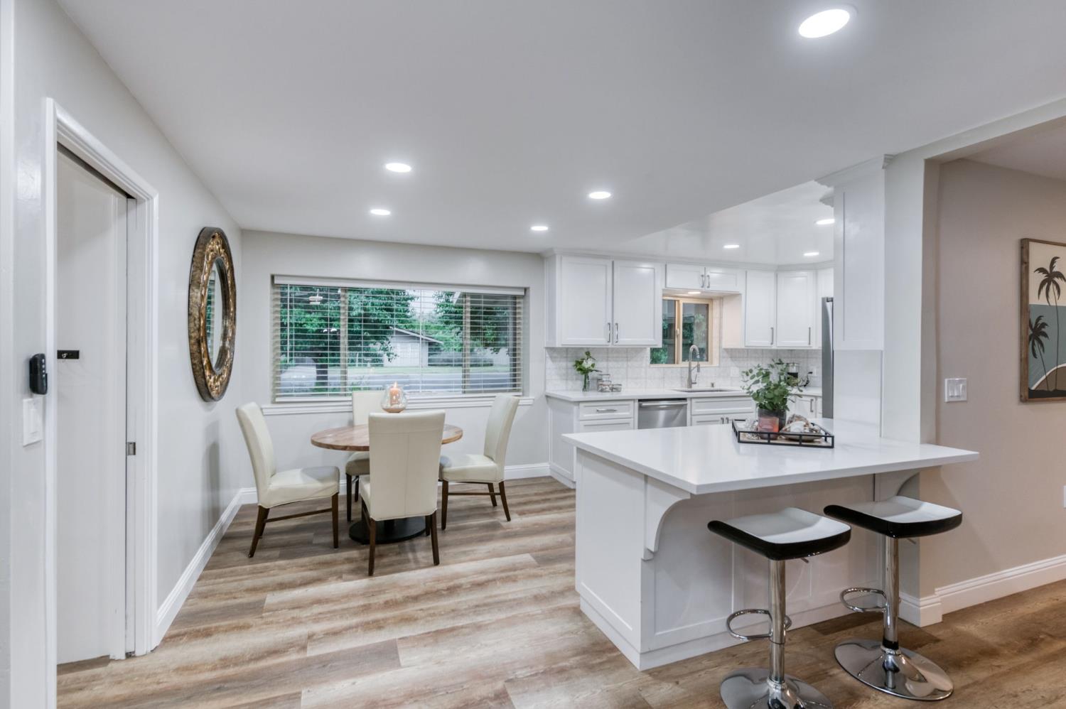 1540 West San Ramon Avenue Fresno, CA 93711 - Photo 12 of 32 a dining room with furniture and a large window