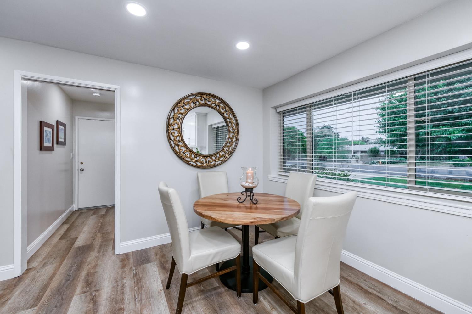 1540 West San Ramon Avenue Fresno, CA 93711 - Photo 17 of 32 a view of a dining room with furniture window and wooden floor