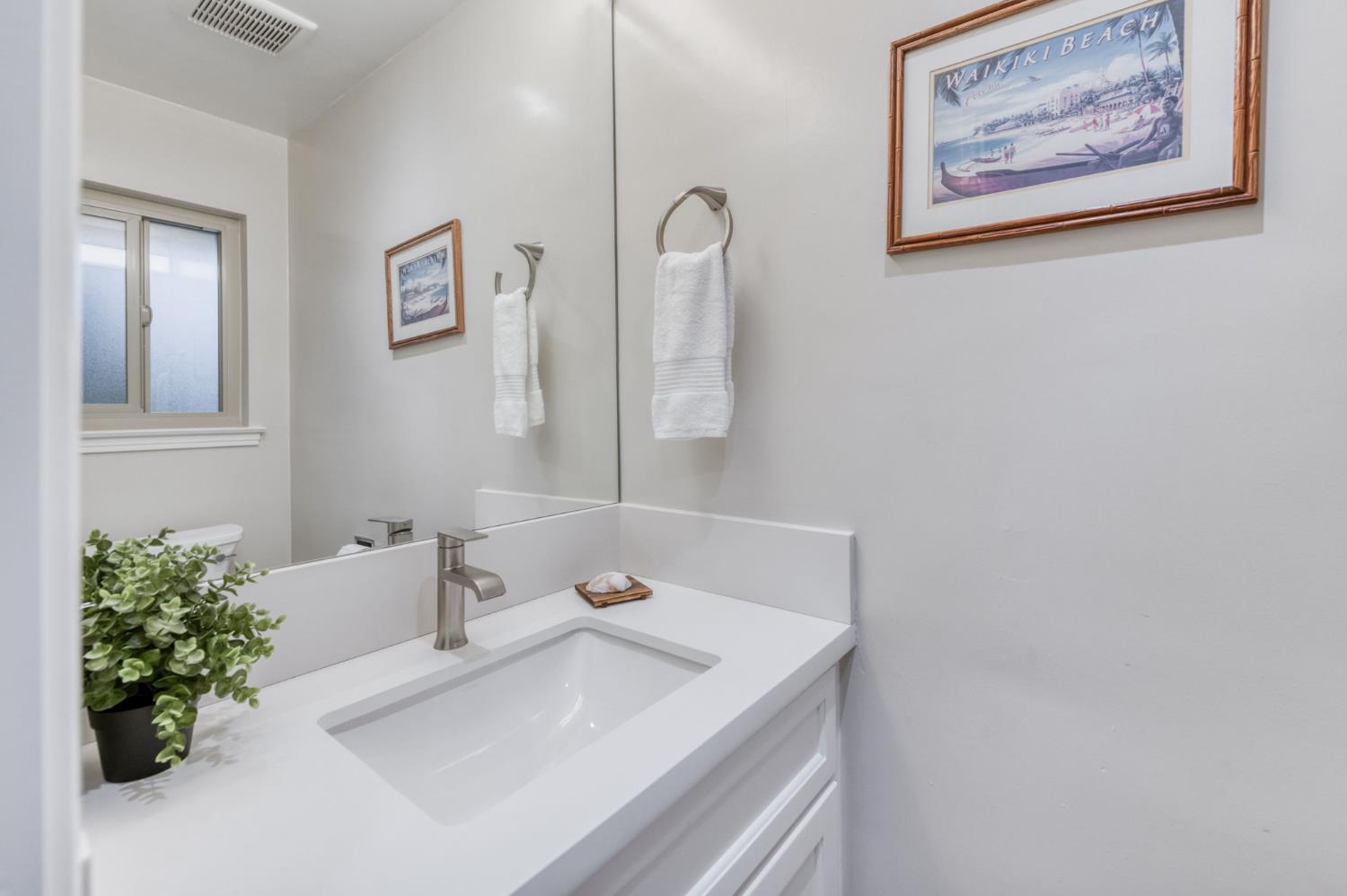 1540 West San Ramon Avenue Fresno, CA 93711 - Photo 20 of 32 a bathroom with a sink and a mirror
