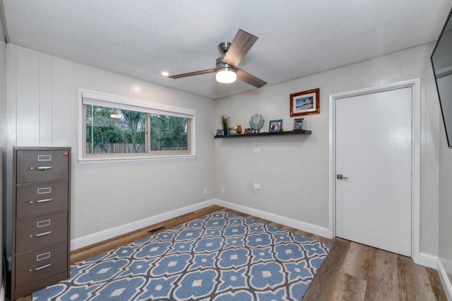 1540 West San Ramon Avenue Fresno, CA 93711 - Photo 21 of 32 a view of an empty room with a window