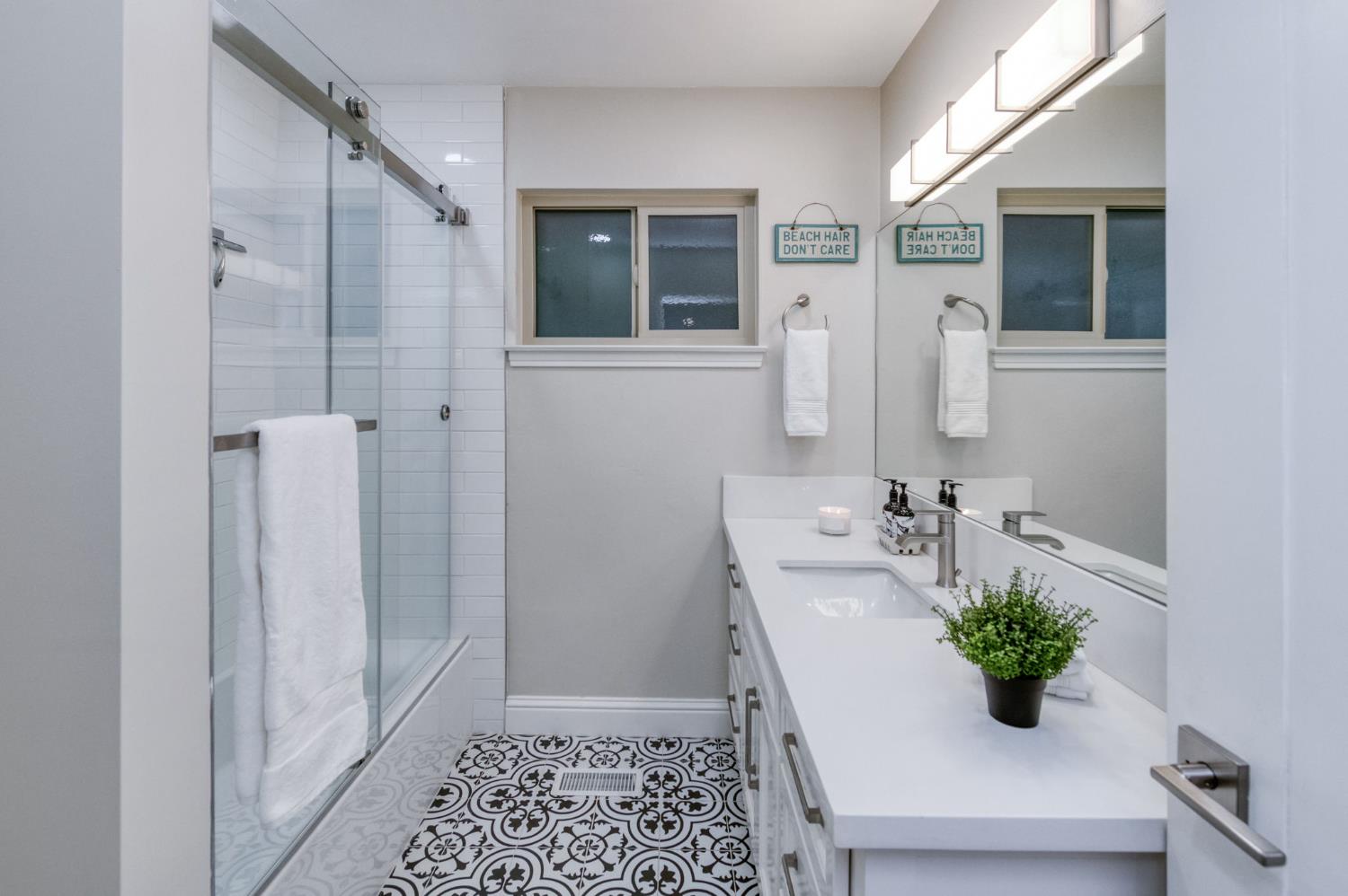 1540 West San Ramon Avenue Fresno, CA 93711 - Photo 27 of 32 a bathroom with a sink and a shower