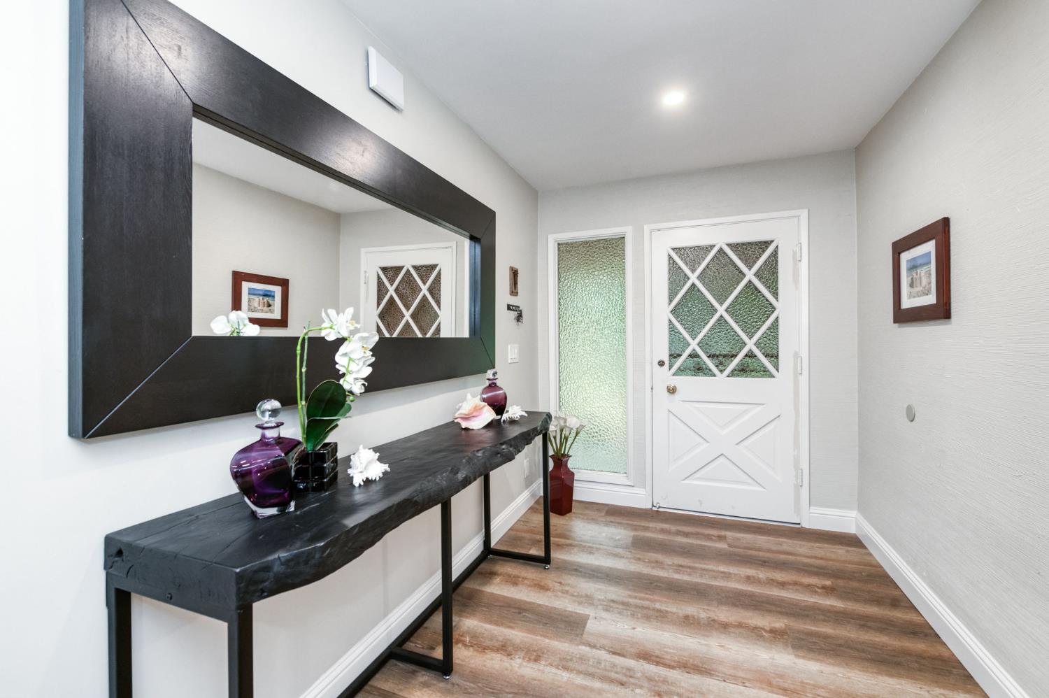 1540 West San Ramon Avenue Fresno, CA 93711 - Photo 5 of 32 a living room with furniture and a potted plant