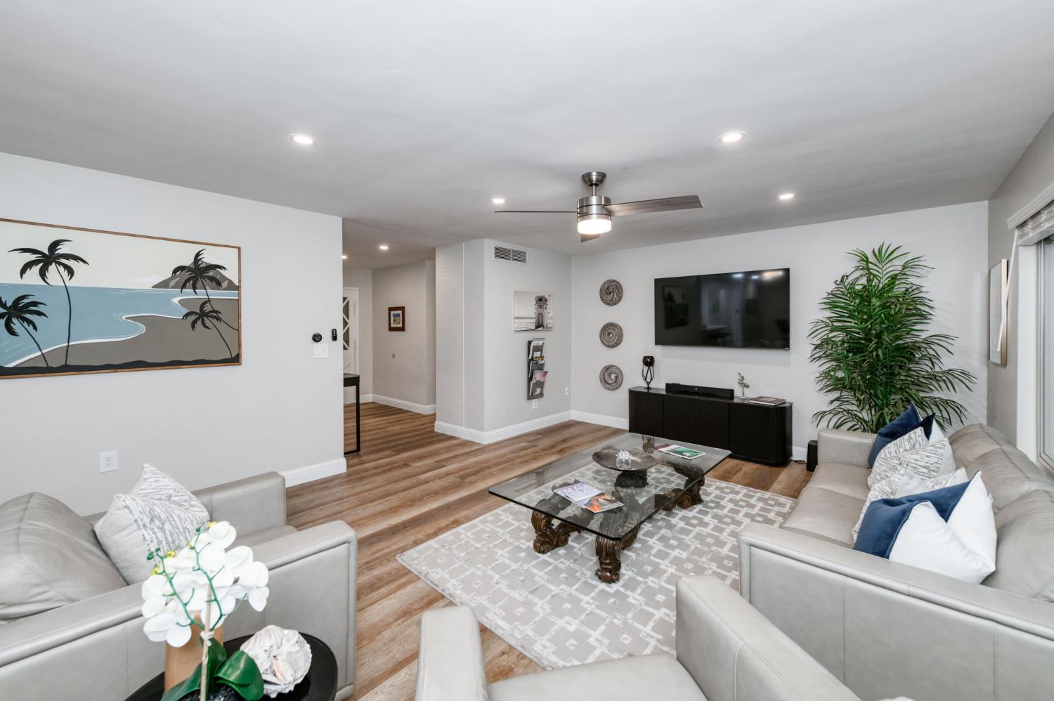 1540 West San Ramon Avenue Fresno, CA 93711 - Photo 8 of 32 a living room with furniture and a flat screen tv