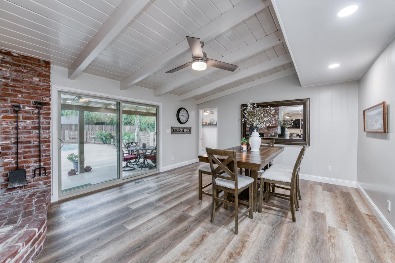 1540 West San Ramon Avenue Fresno, CA 93711 - Photo 10 of 32 a dining room with furniture and wooden floor