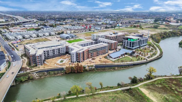 an aerial view of residential houses with outdoor space