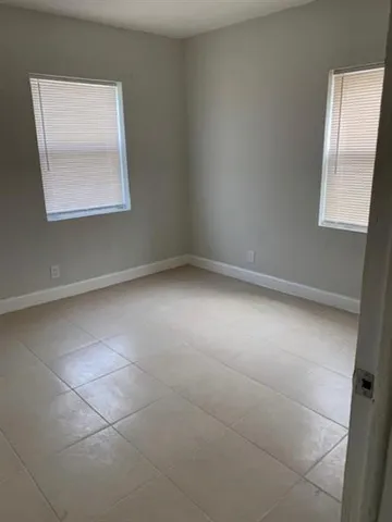a bathroom with a toilet and a bath tub