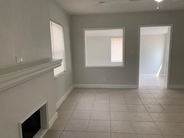 a view of an empty room with a window