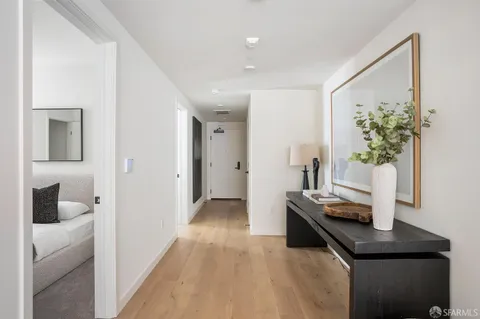 a bedroom with a bed and a night stand