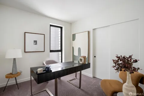 a view of a street in a residential apartment building