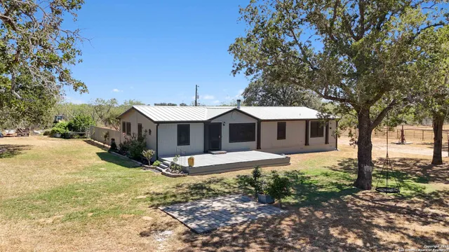 a house view with a backyard space