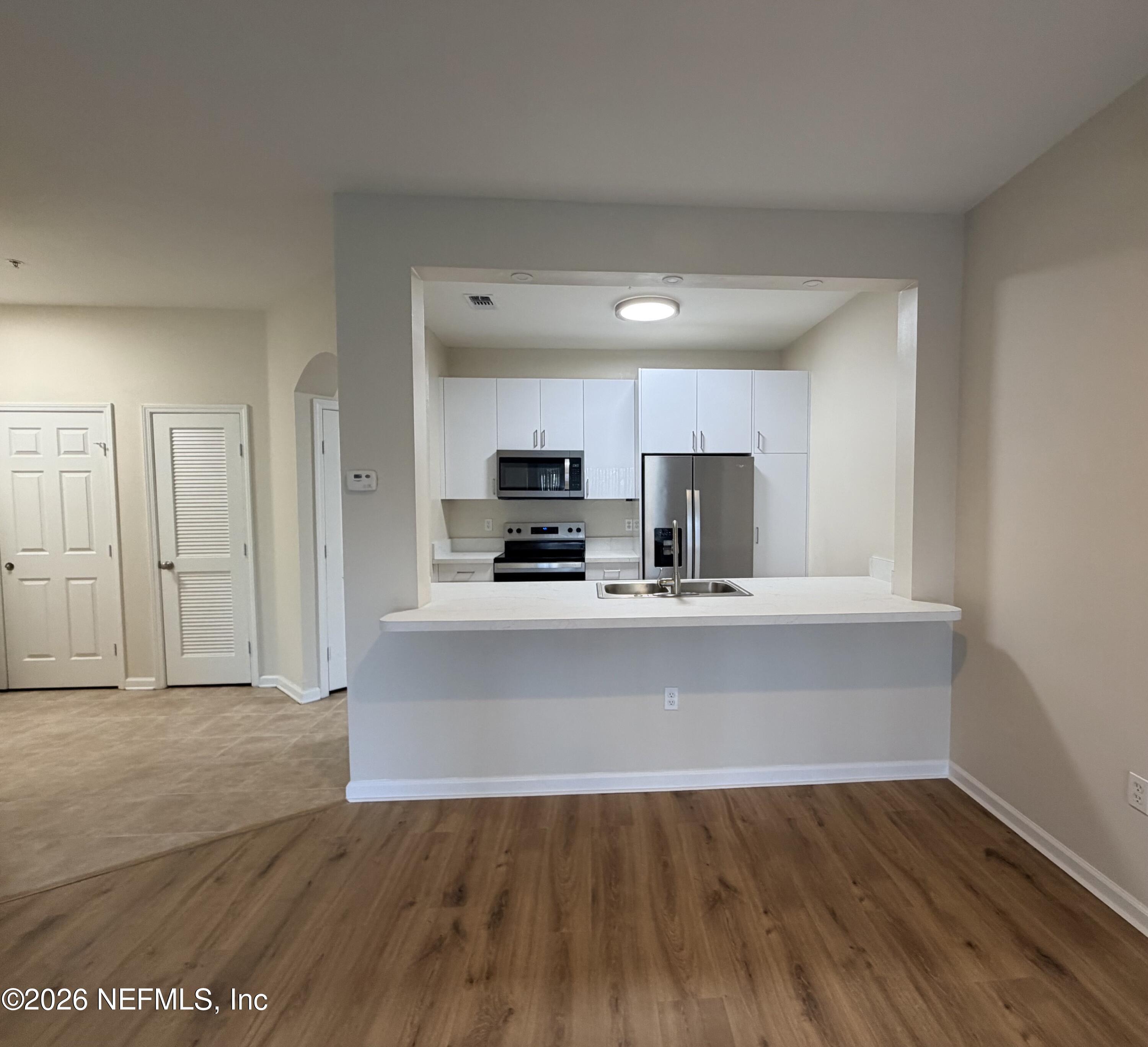 7990 Baymeadows Road East, Unit 1111 Jacksonville, FL 32256 - Photo 1 of 25 Kitchen/ Living Area