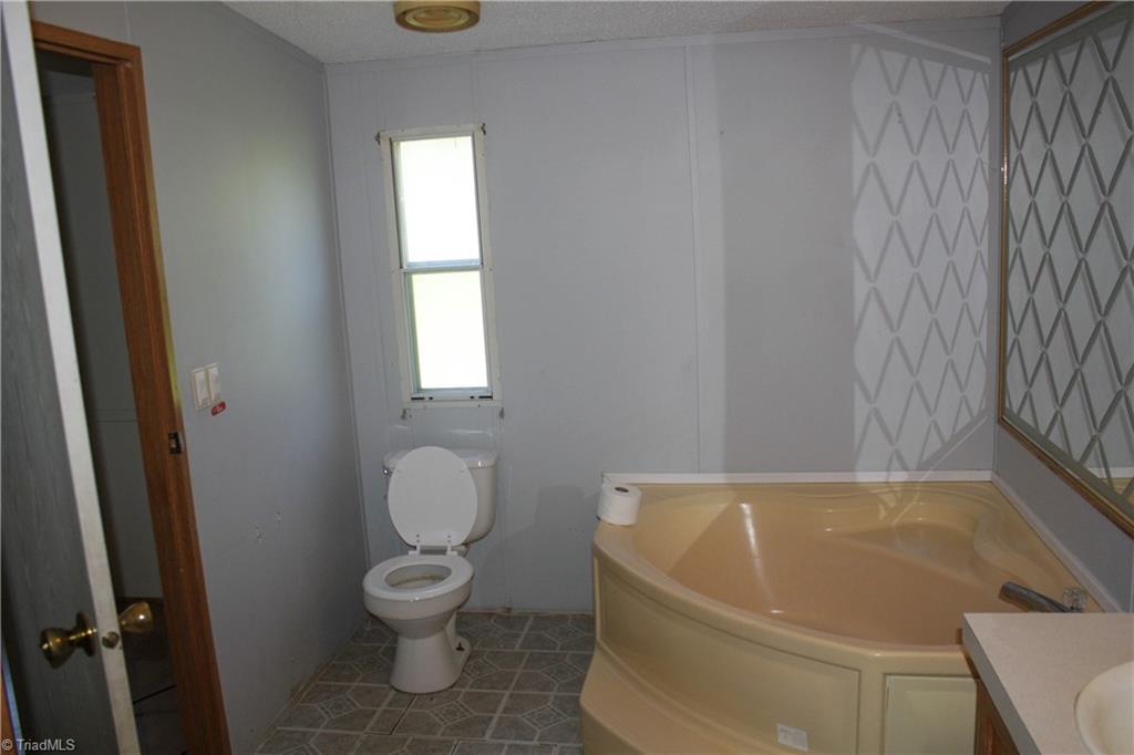 106 Childrens Home Road Mocksville, NC 27028 - Photo 7 of 12 Soaker tub in primary bathroom