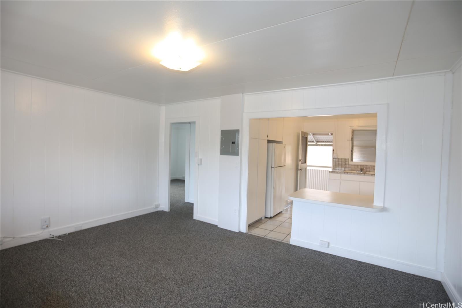 an empty room with a empty space and windows