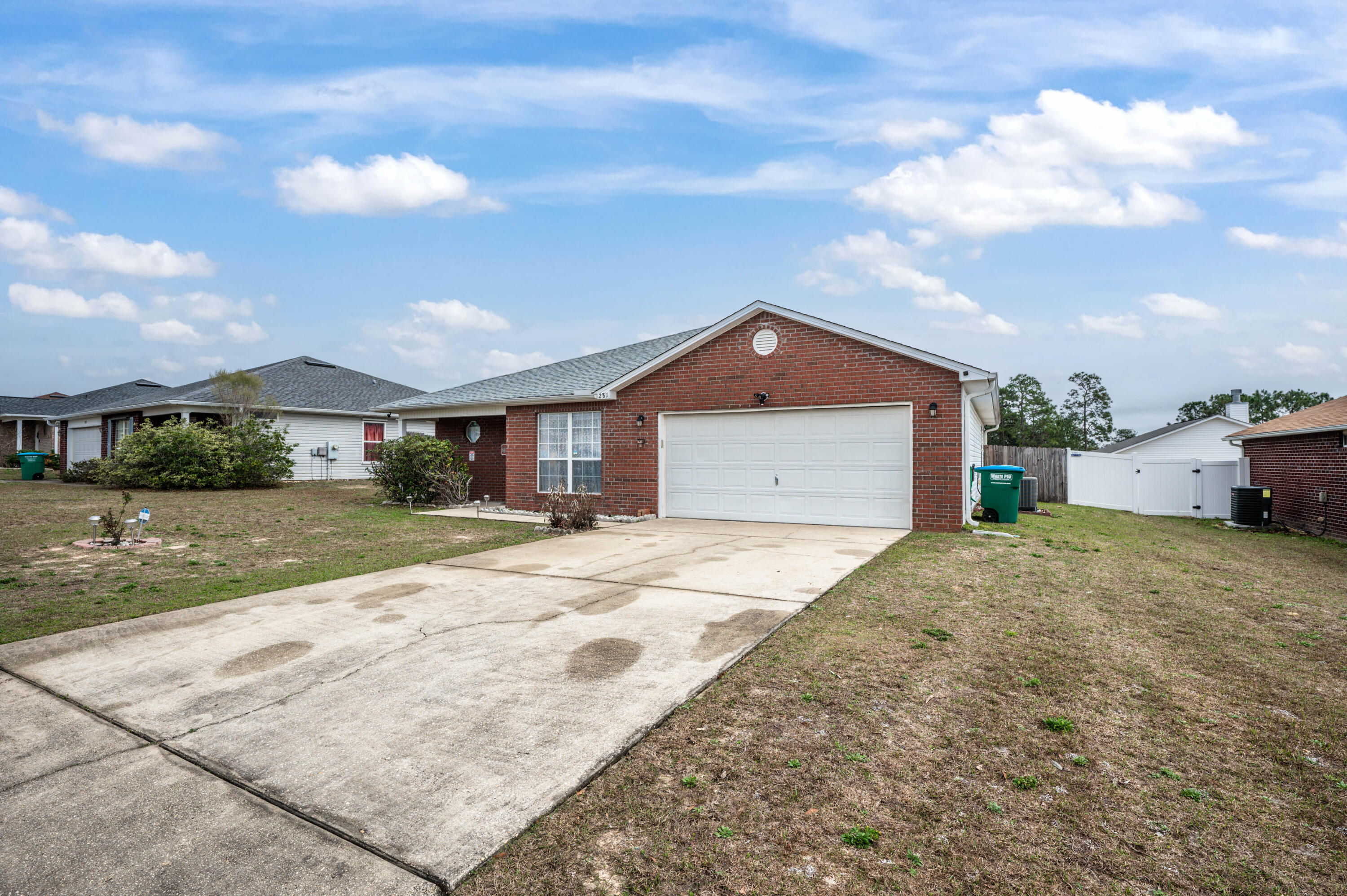 281 Limestone Circle Crestview, FL 32539 - Photo 1 of 46 a front view of a house with a yard and garage