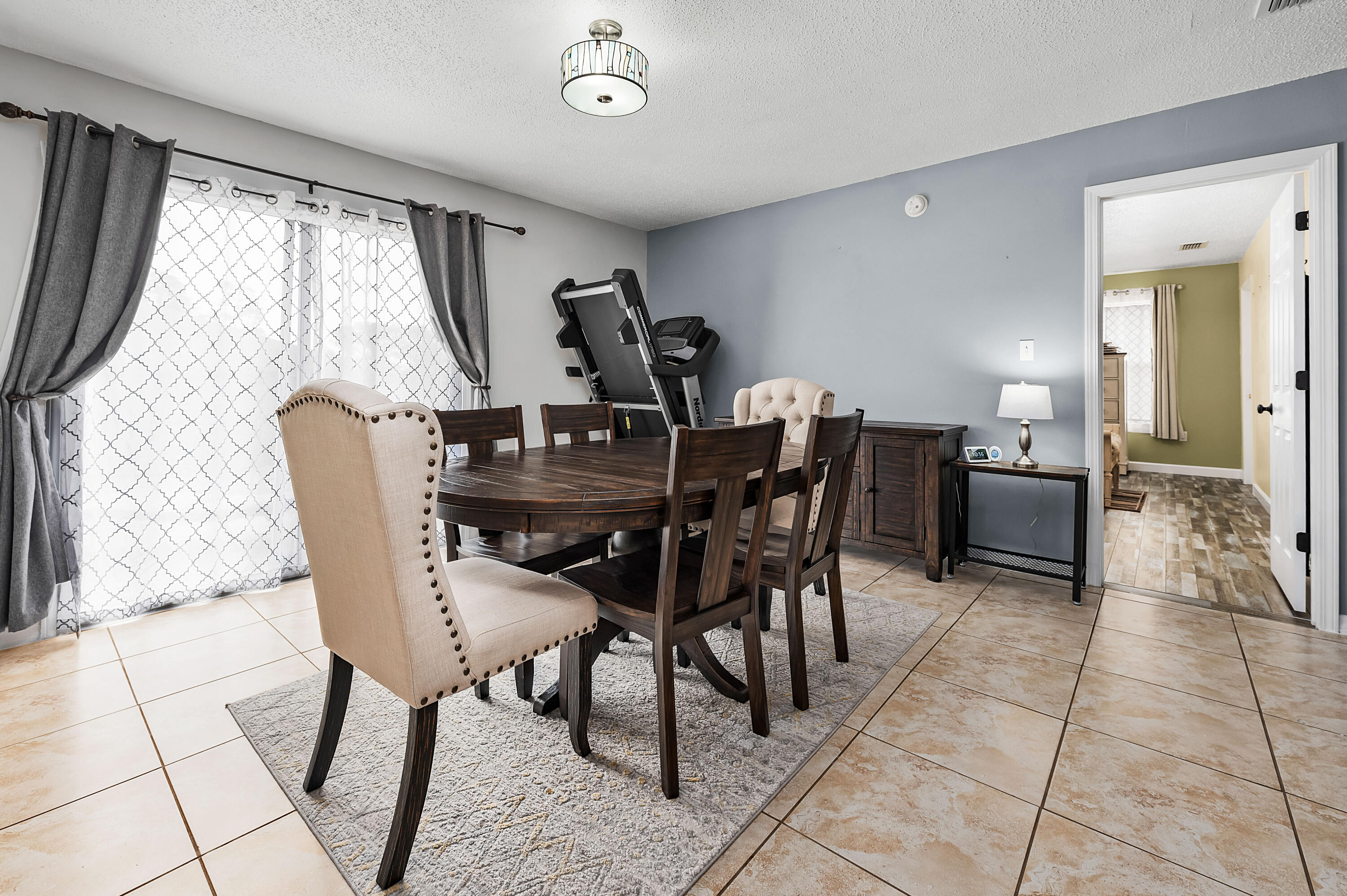281 Limestone Circle Crestview, FL 32539 - Photo 15 of 46 a view of a dining room with furniture and a window