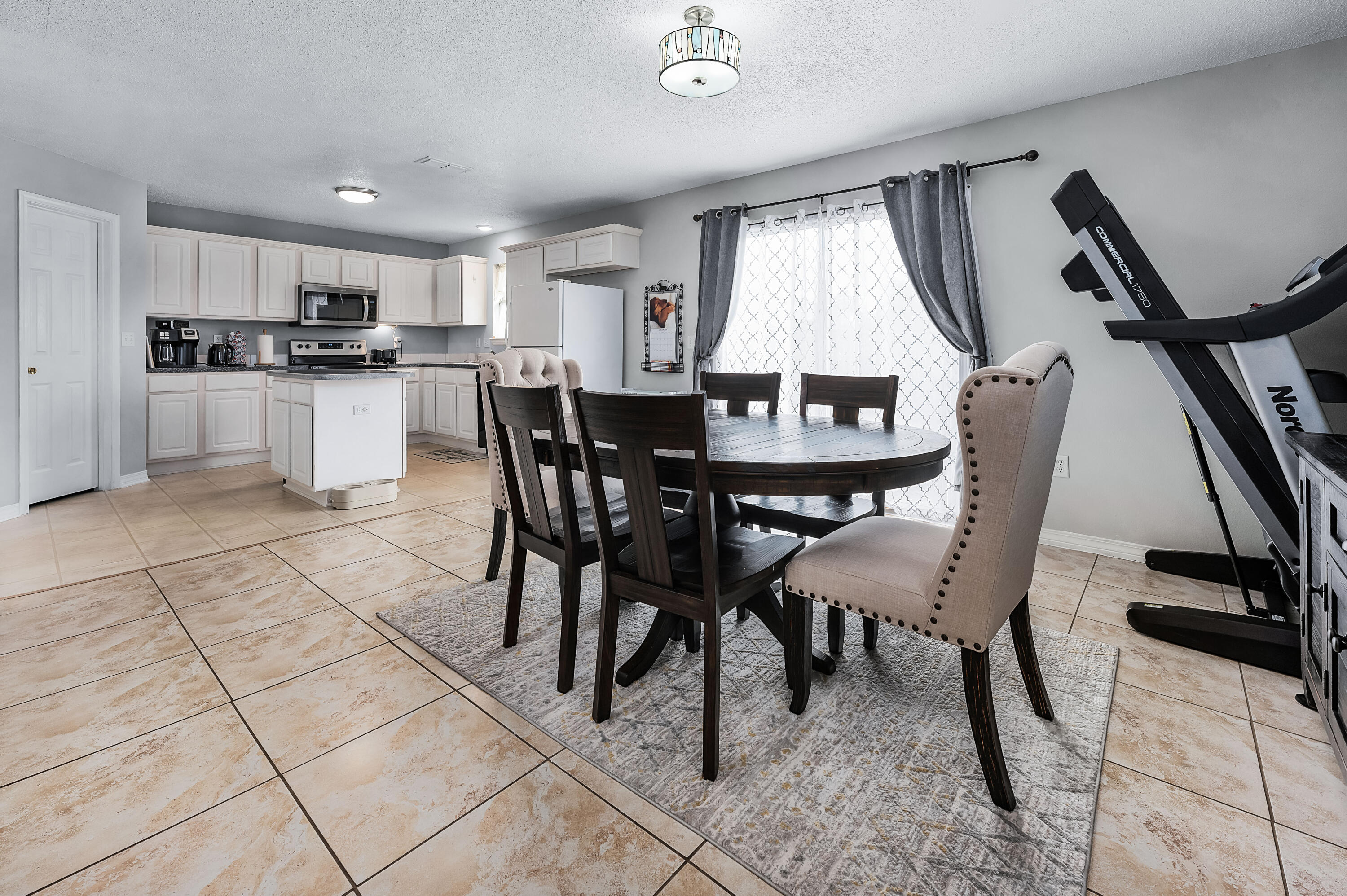 281 Limestone Circle Crestview, FL 32539 - Photo 16 of 46 a view of a dining room with furniture