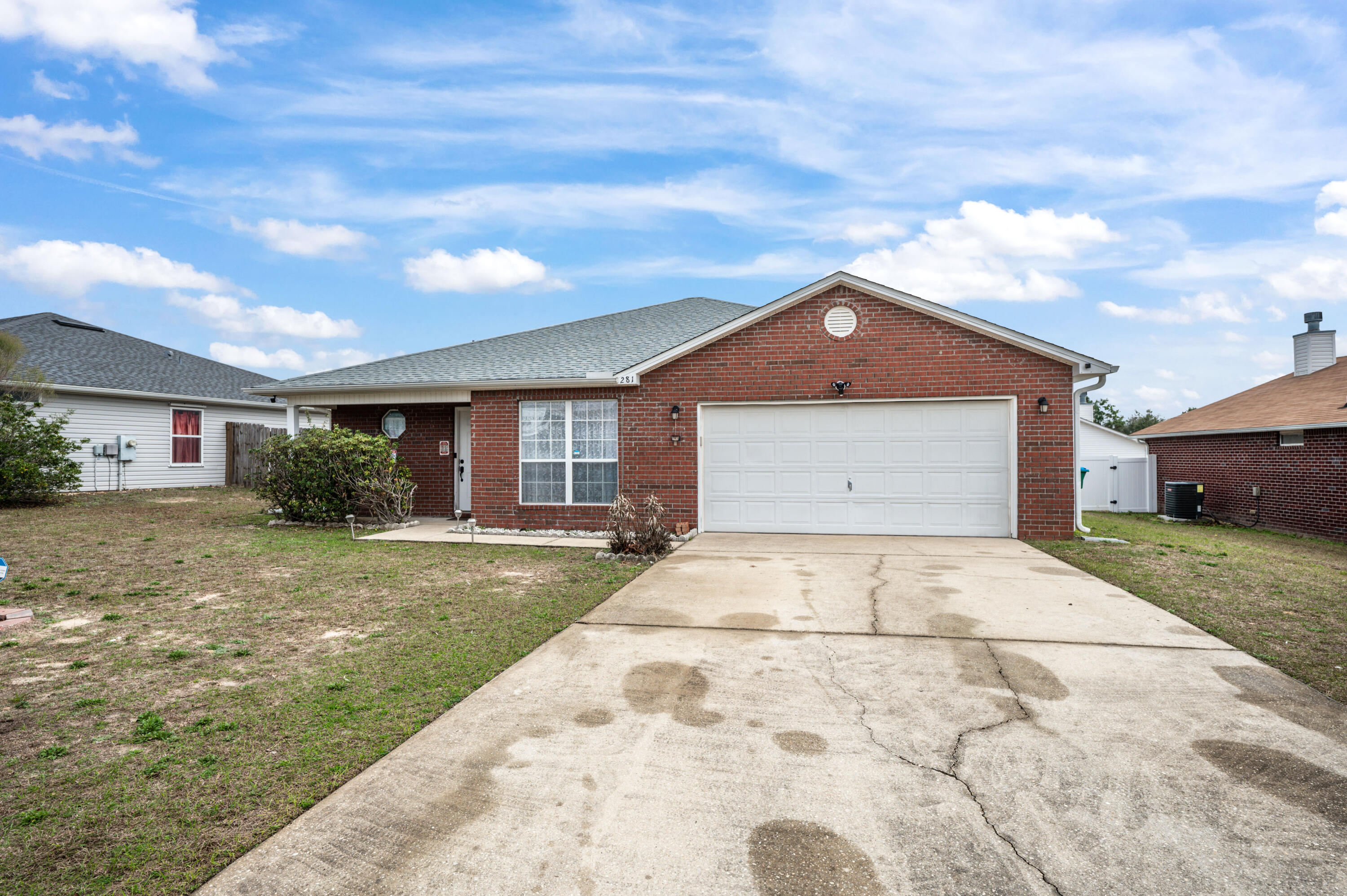 281 Limestone Circle Crestview, FL 32539 - Photo 2 of 46 a front view of a house with a yard and garage