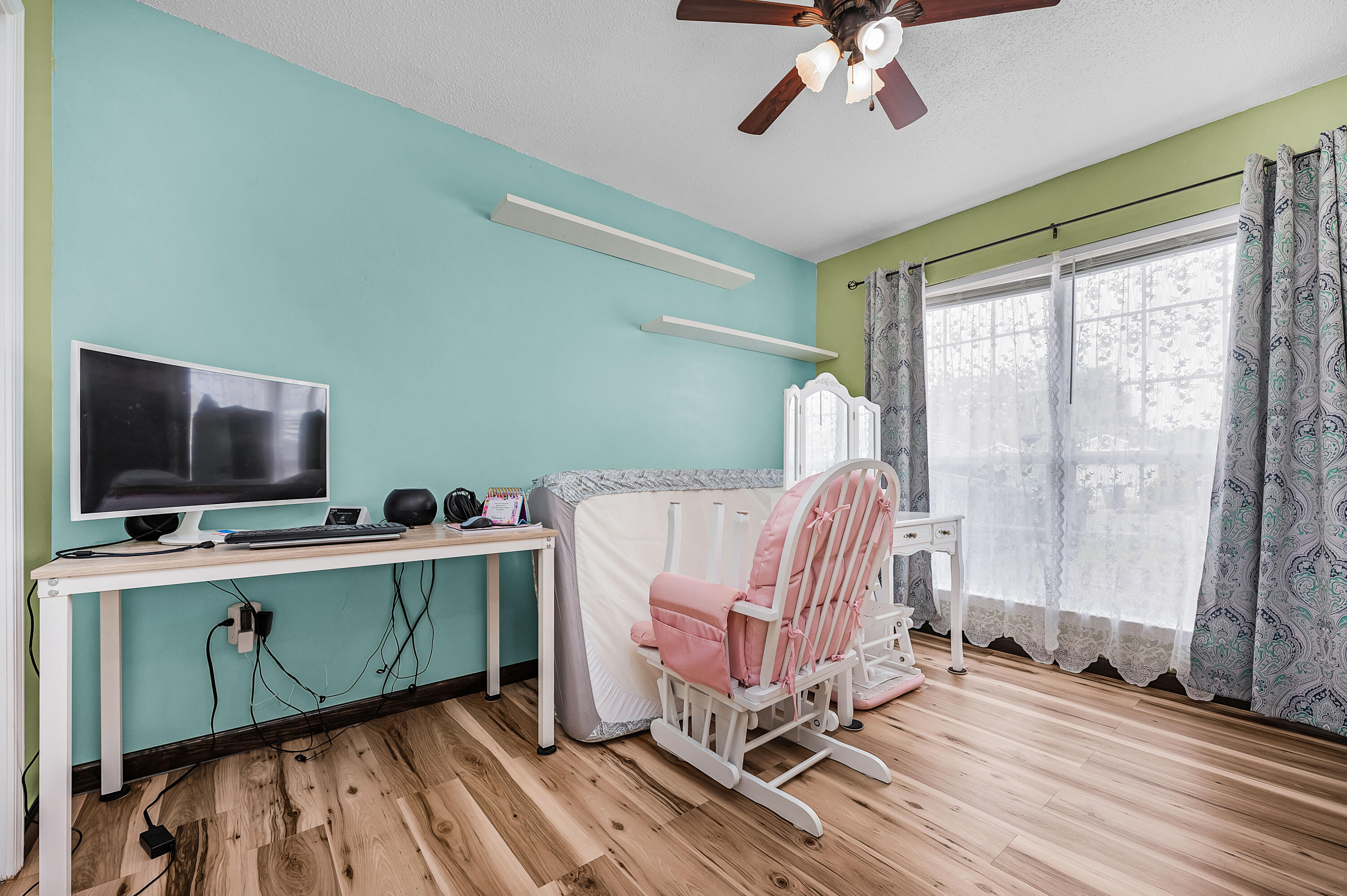 281 Limestone Circle Crestview, FL 32539 - Photo 23 of 46 a room with furniture and a flat screen tv