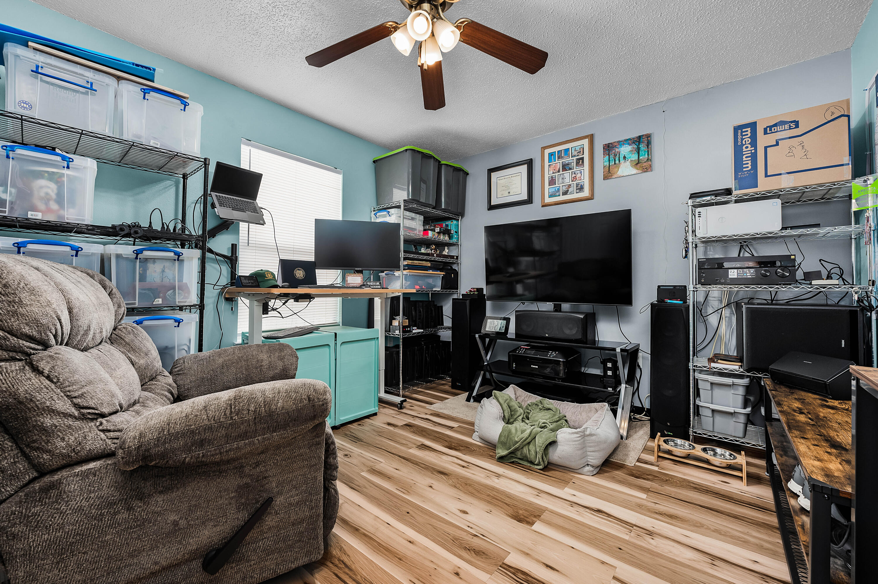 281 Limestone Circle Crestview, FL 32539 - Photo 26 of 46 a living room with furniture and a flat screen tv