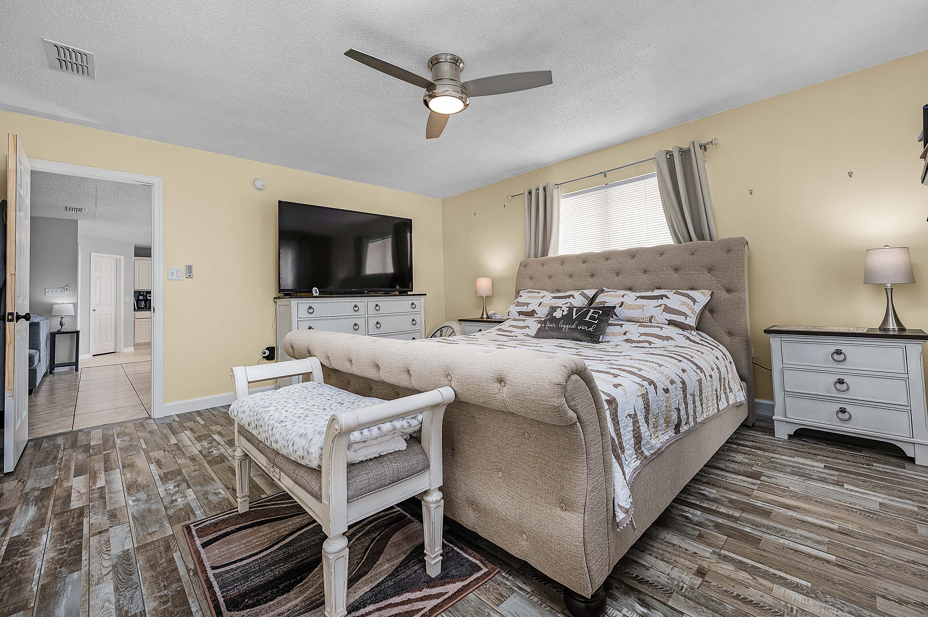 281 Limestone Circle Crestview, FL 32539 - Photo 33 of 46 a bedroom with a bed and a flat screen tv