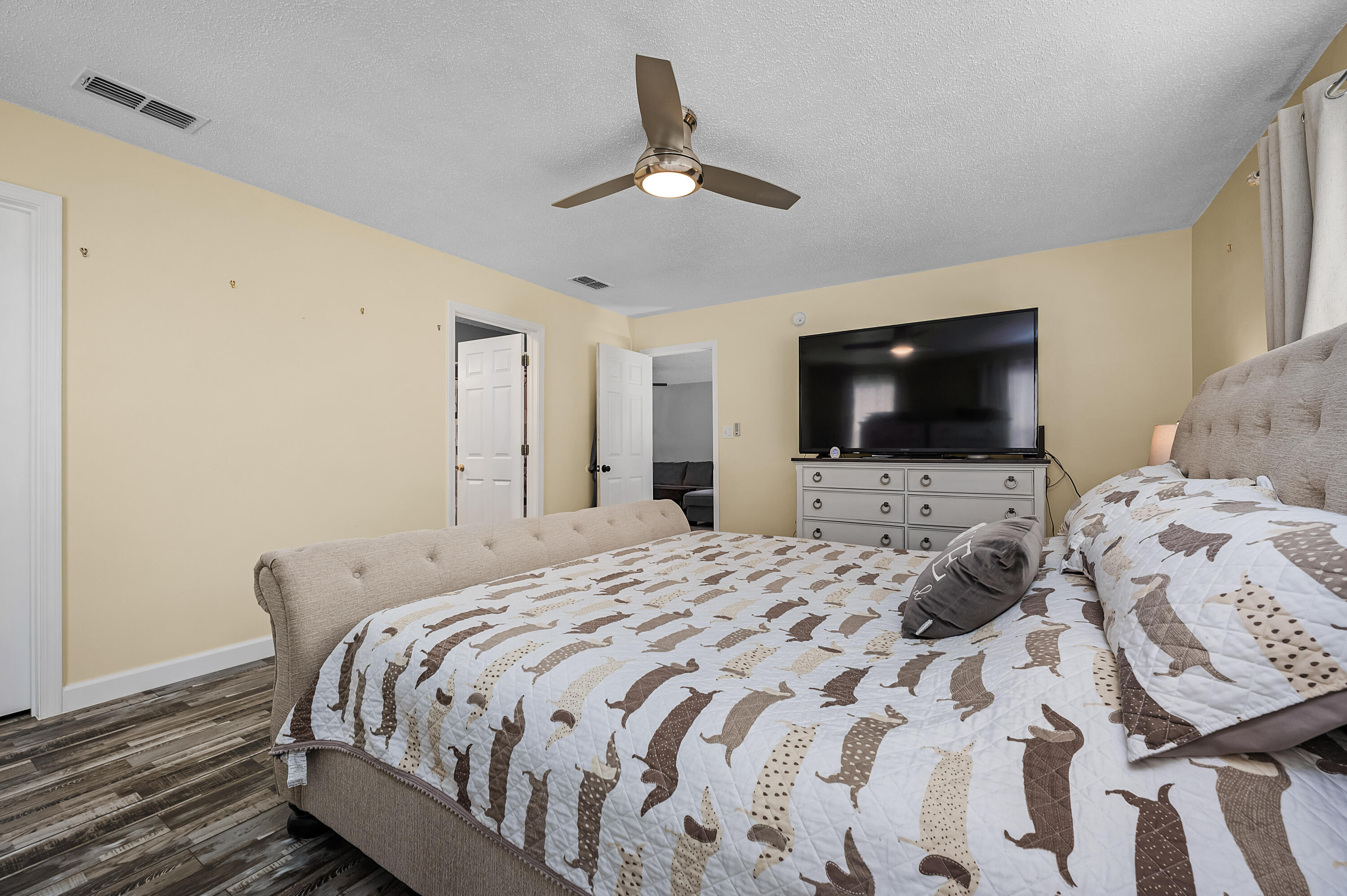 281 Limestone Circle Crestview, FL 32539 - Photo 34 of 46 a bedroom with a bed and a flat screen tv