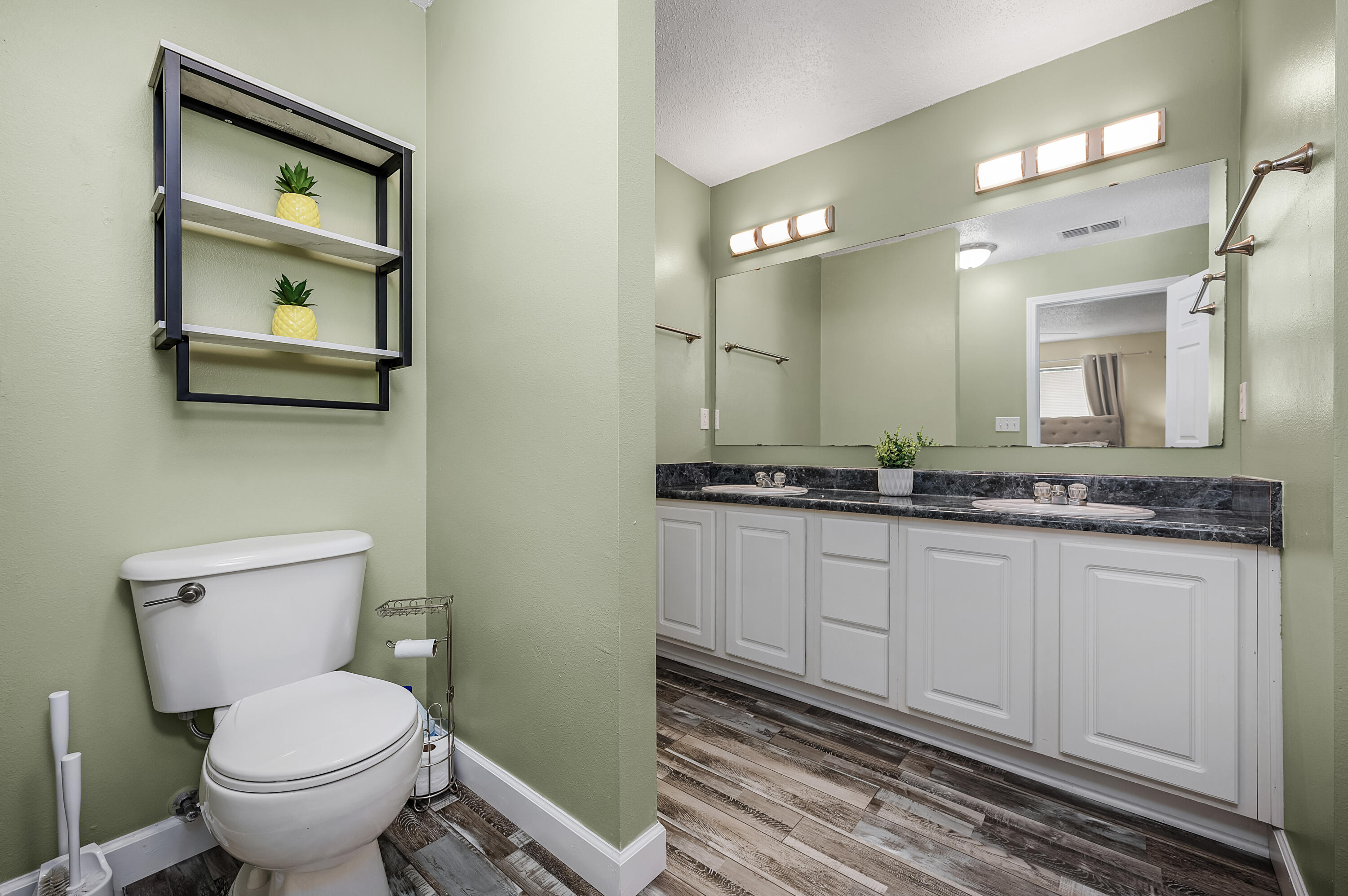 281 Limestone Circle Crestview, FL 32539 - Photo 35 of 46 a bathroom with a toilet sink and mirror