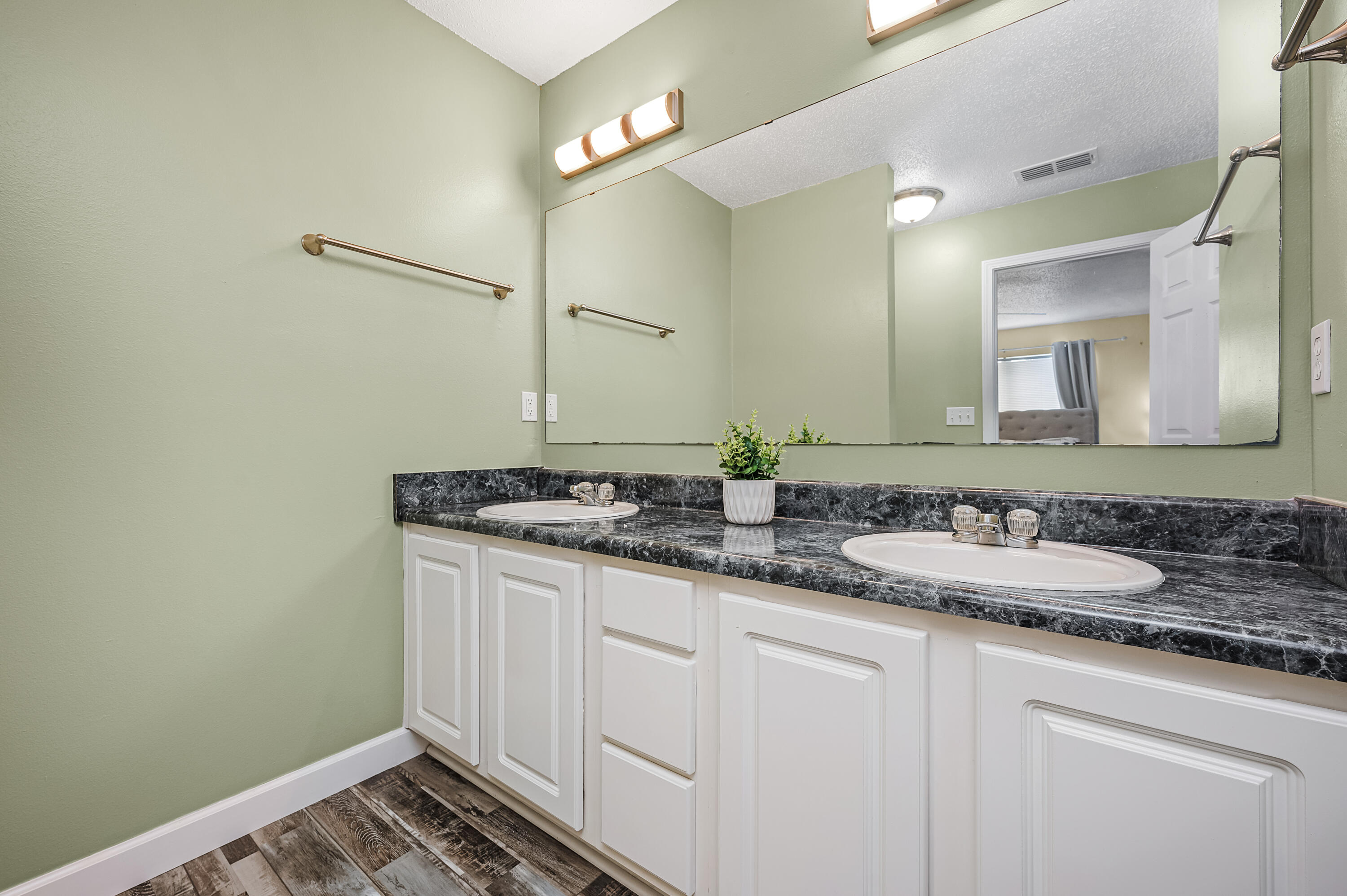 281 Limestone Circle Crestview, FL 32539 - Photo 36 of 46 a bathroom with a sink and a mirror