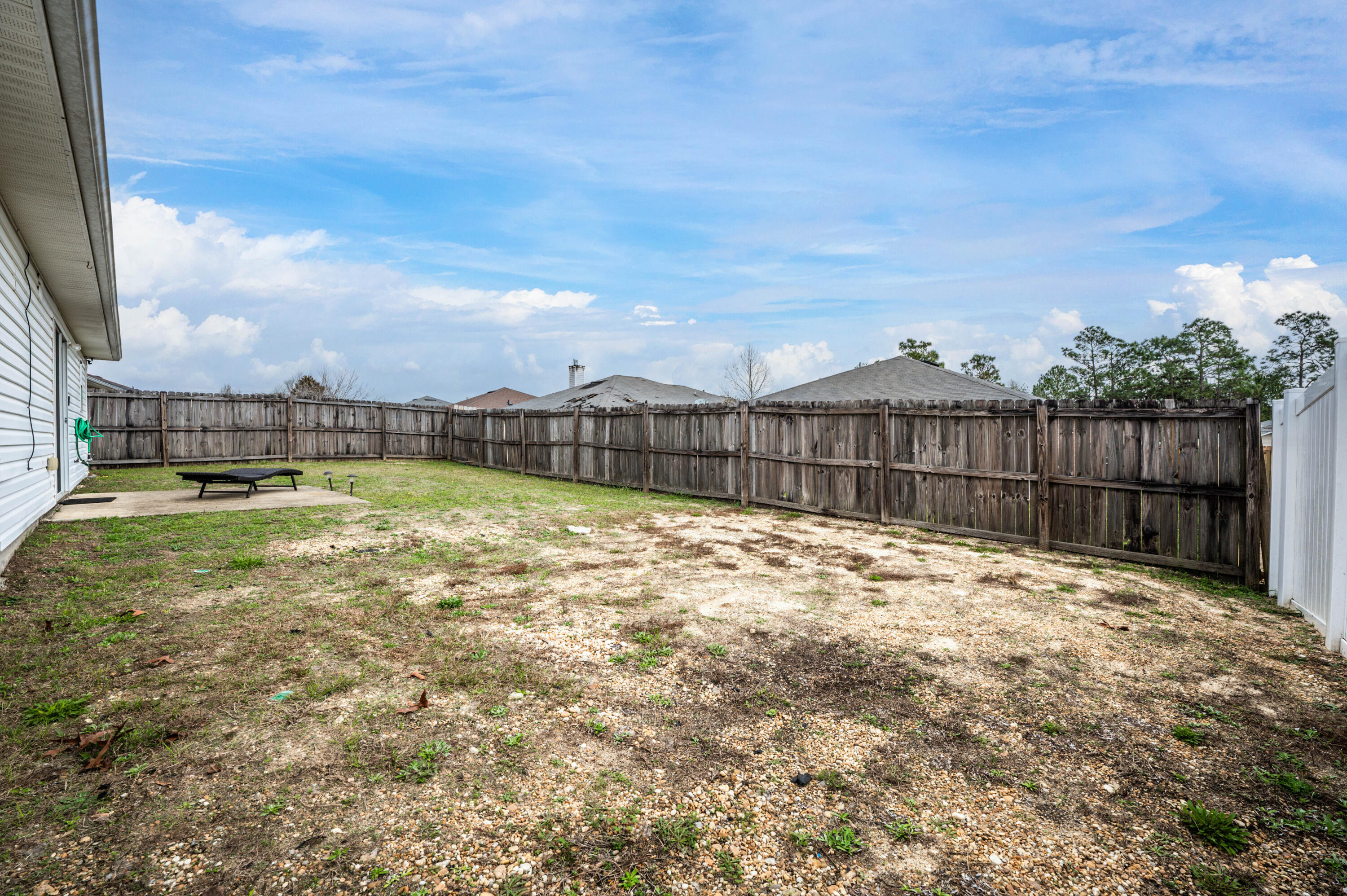 281 Limestone Circle Crestview, FL 32539 - Photo 41 of 46 a view of a backyard with a garden