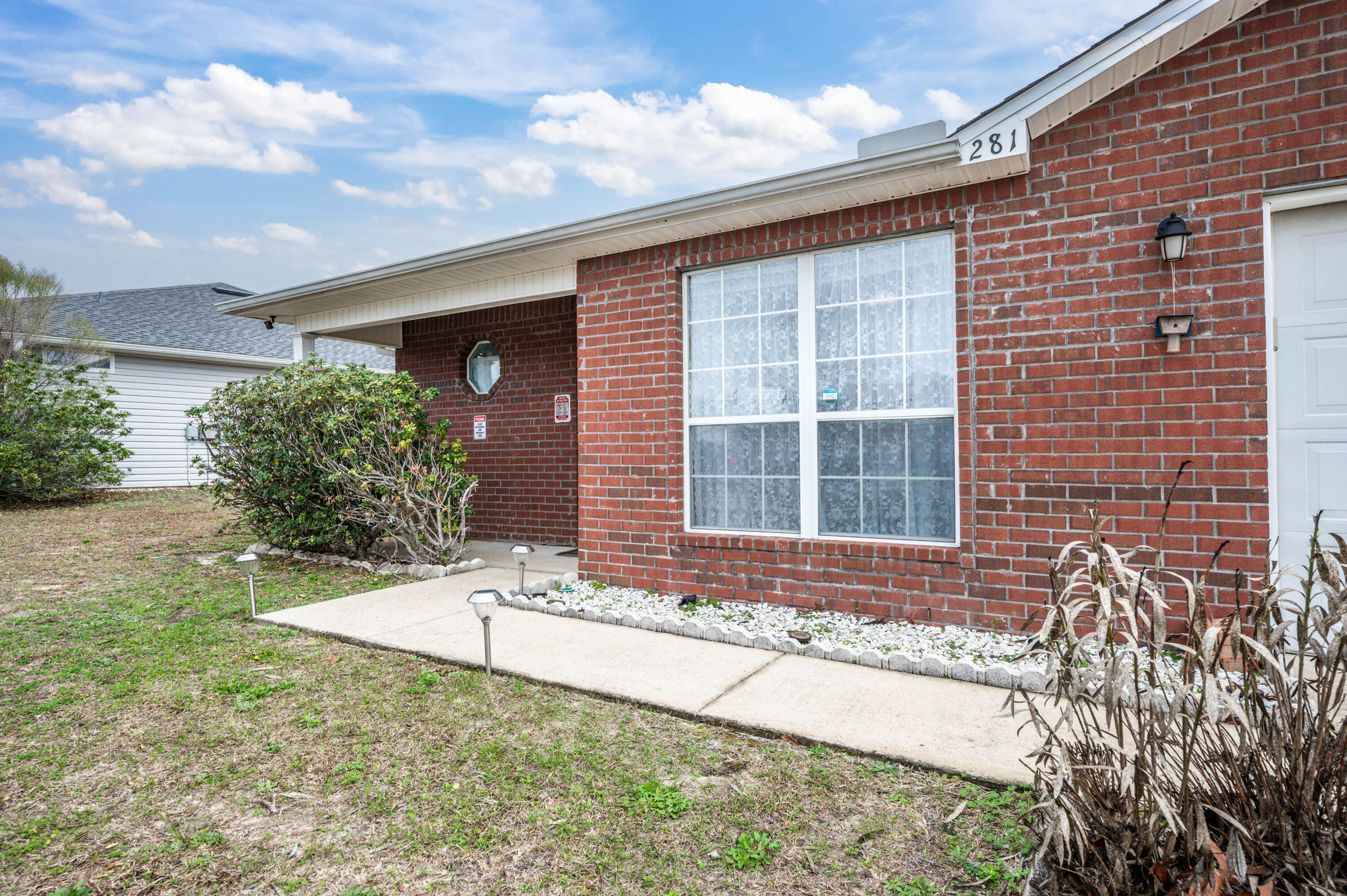 281 Limestone Circle Crestview, FL 32539 - Photo 5 of 46 a front view of a house with a yard