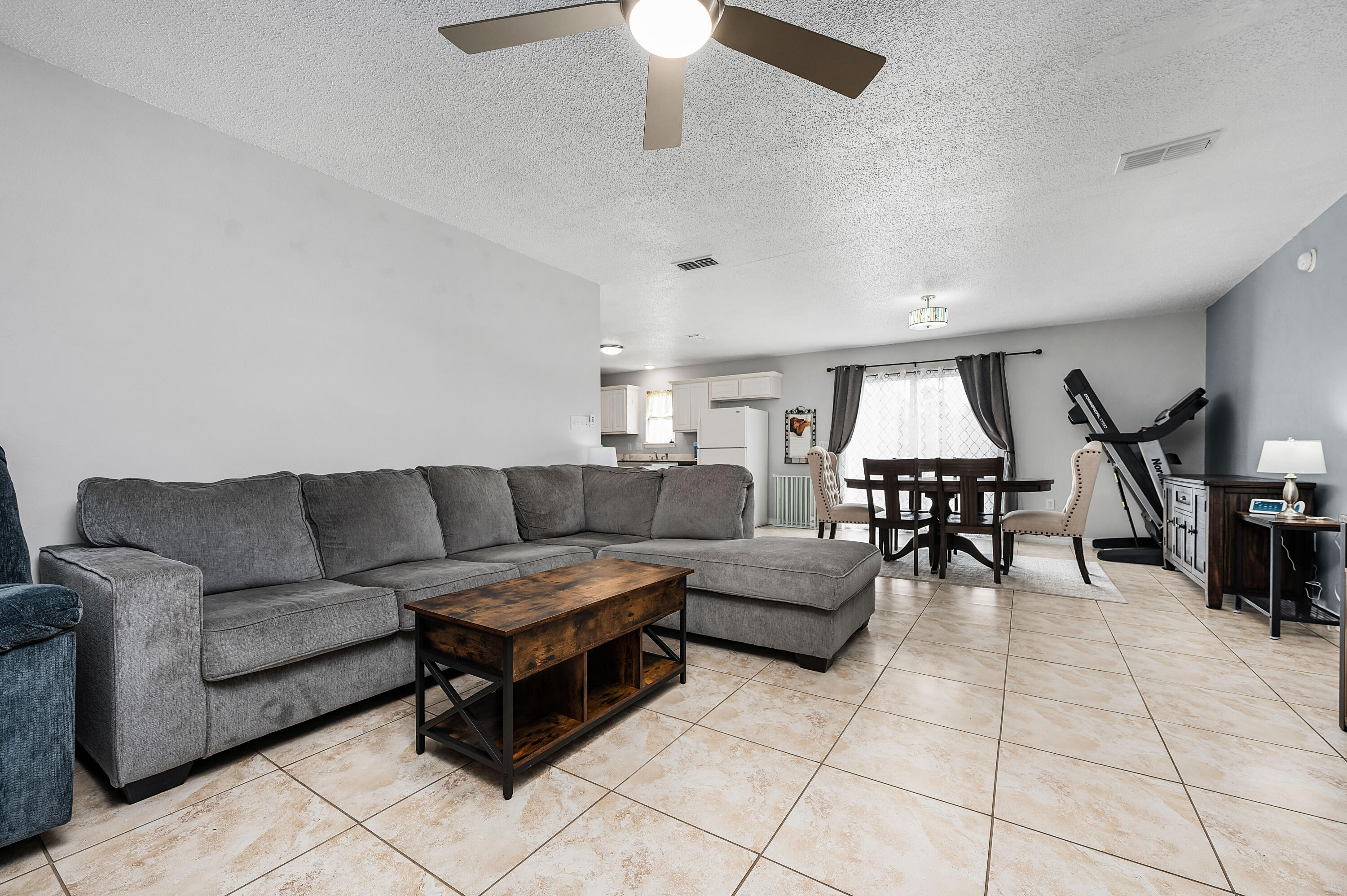 281 Limestone Circle Crestview, FL 32539 - Photo 10 of 46 a living room with furniture and a dining table with projector room