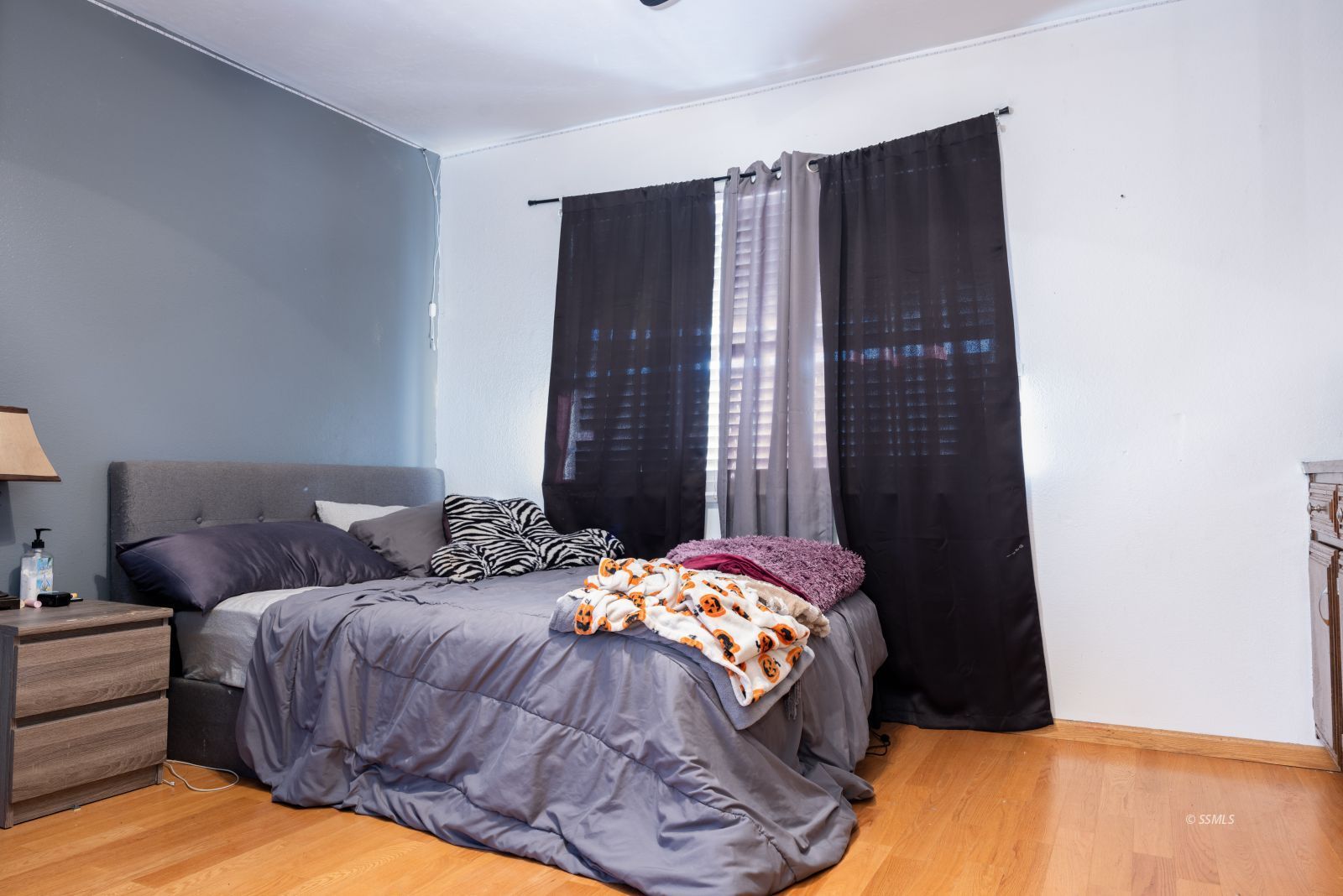 737 Mamie Street Ridgecrest, CA 93555 - Photo 27 of 41 a bedroom with a bed and a cabinets