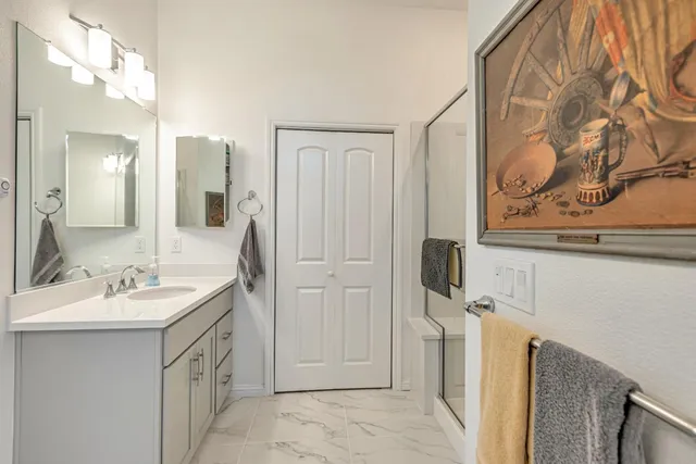 a bathroom with a sink and a mirror