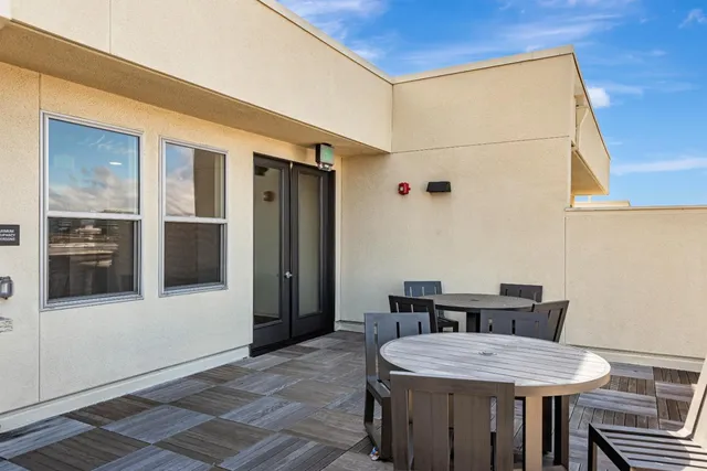 a dining room with a table and chairs