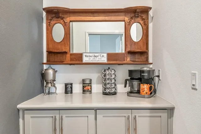 a kitchen with sink and cabinets