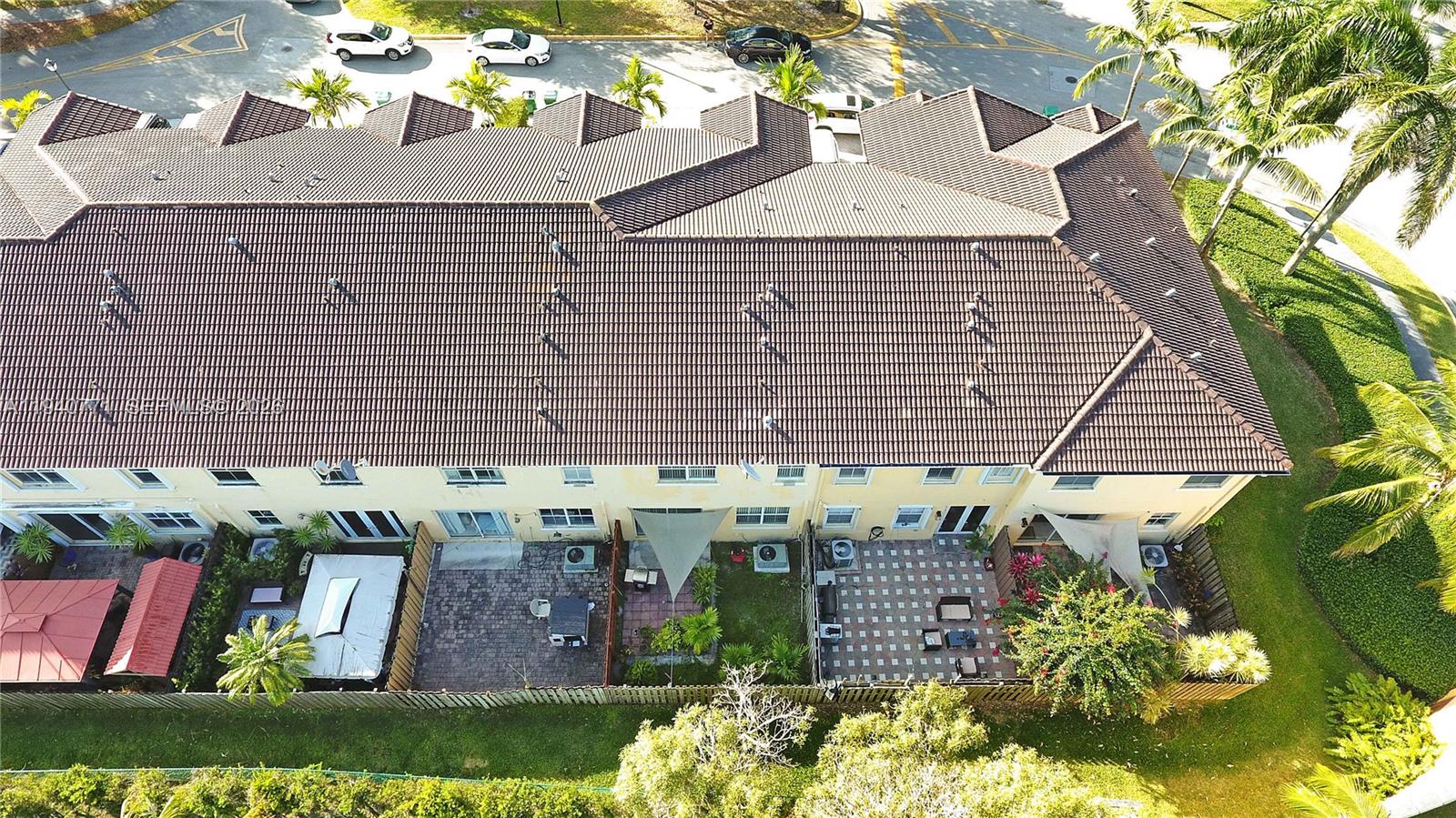 14973 Southwest 8th Terrace Miami, FL 33194 - Photo 28 of 32 a view of a patio with table and chairs potted plants