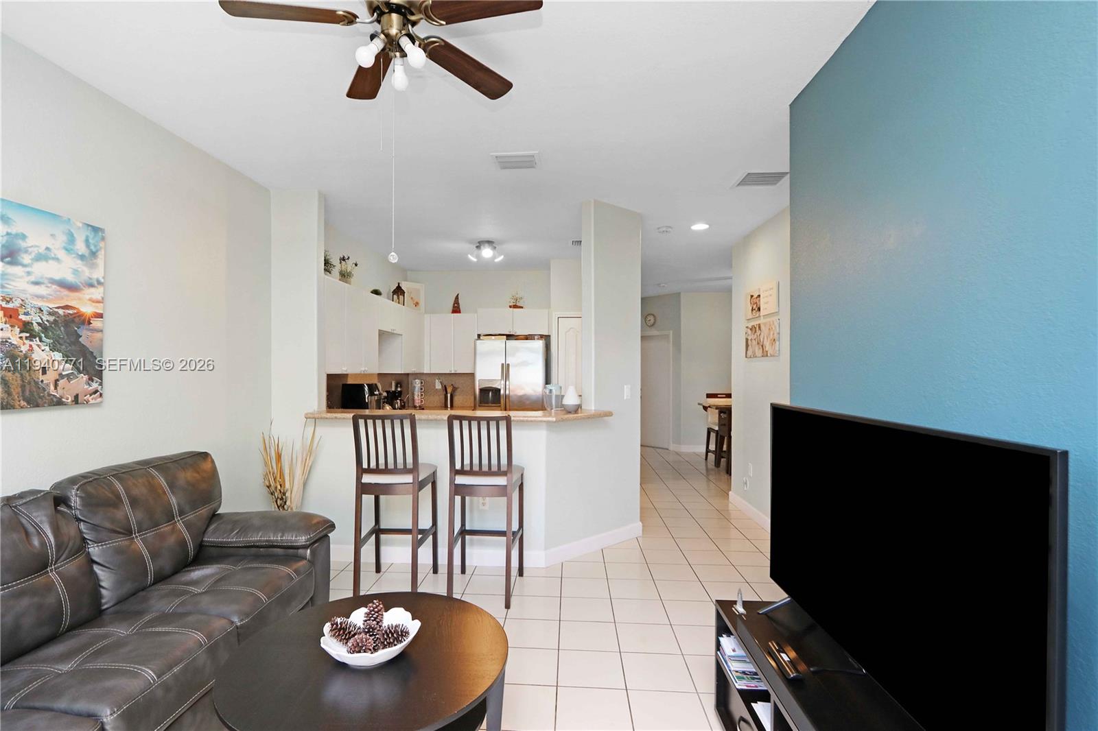 14973 Southwest 8th Terrace Miami, FL 33194 - Photo 7 of 32 a living room with furniture and kitchen view
