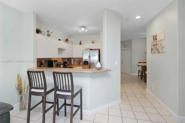 a view of kitchen with furniture and workspace