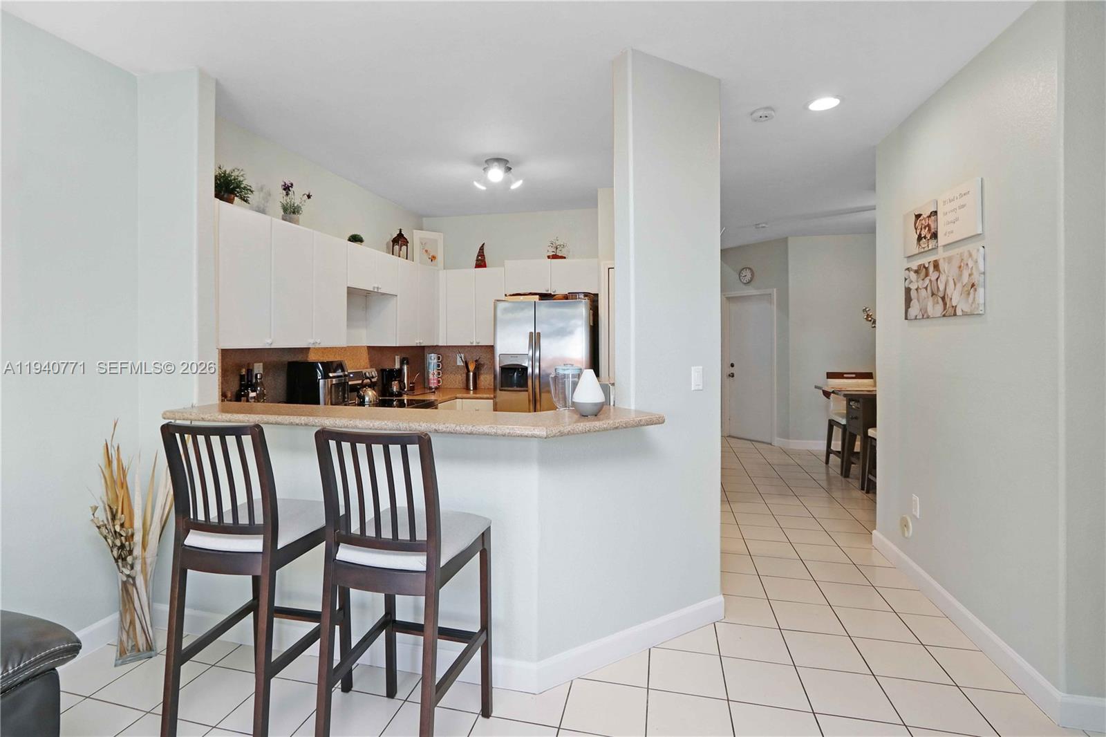 14973 Southwest 8th Terrace Miami, FL 33194 - Photo 8 of 32 a view of kitchen with furniture and workspace
