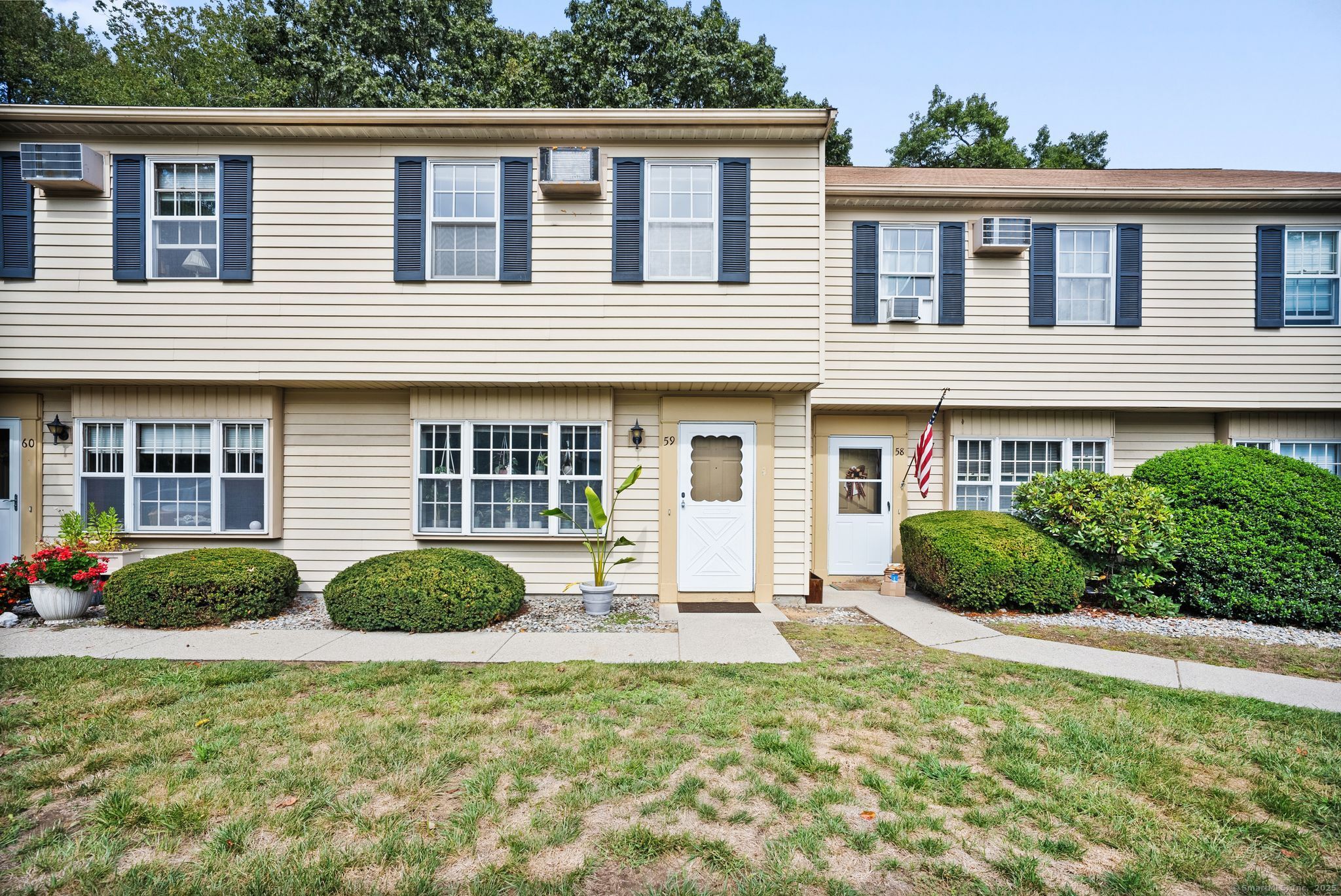 a front view of a house with a yard