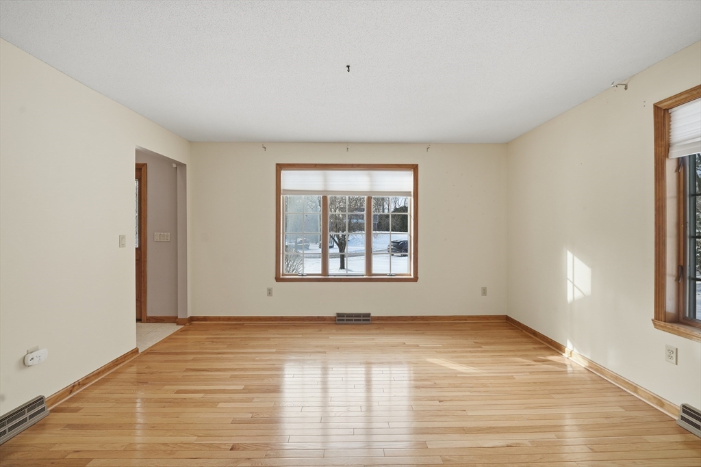37 Wyndermere Place Ludlow, MA 01056 - Photo 16 of 42 a view of an empty room with wooden floor and a window