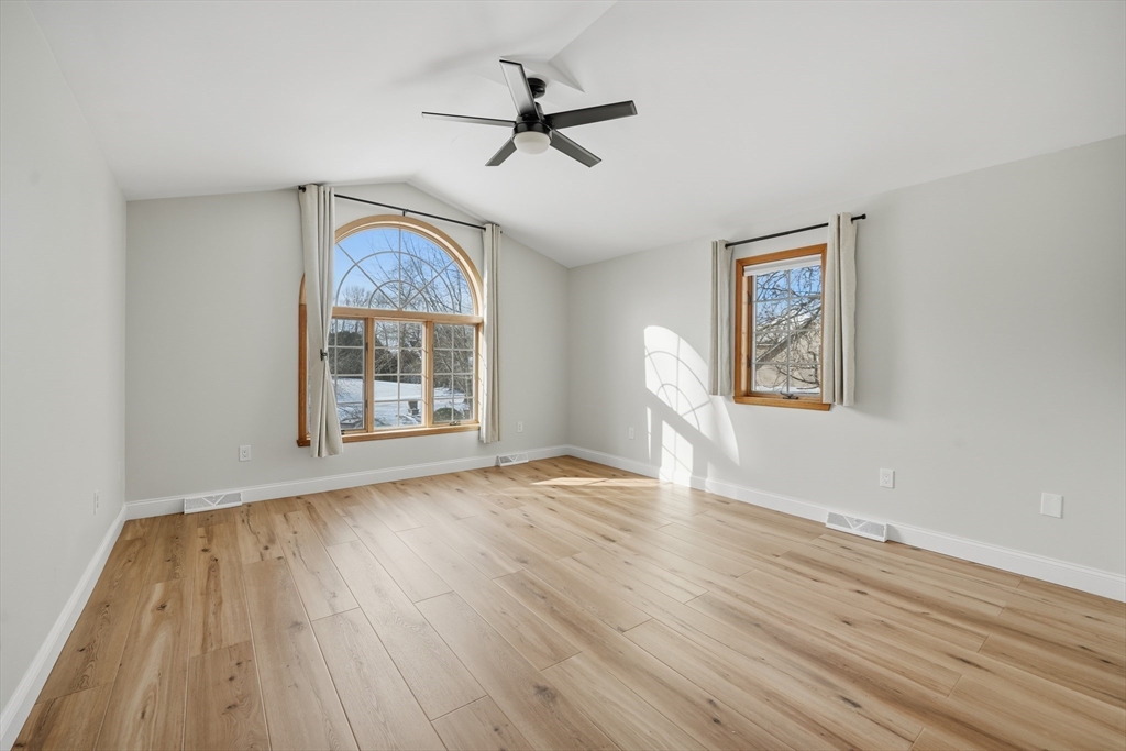 37 Wyndermere Place Ludlow, MA 01056 - Photo 18 of 42 a view of an empty room with a window and wooden floor