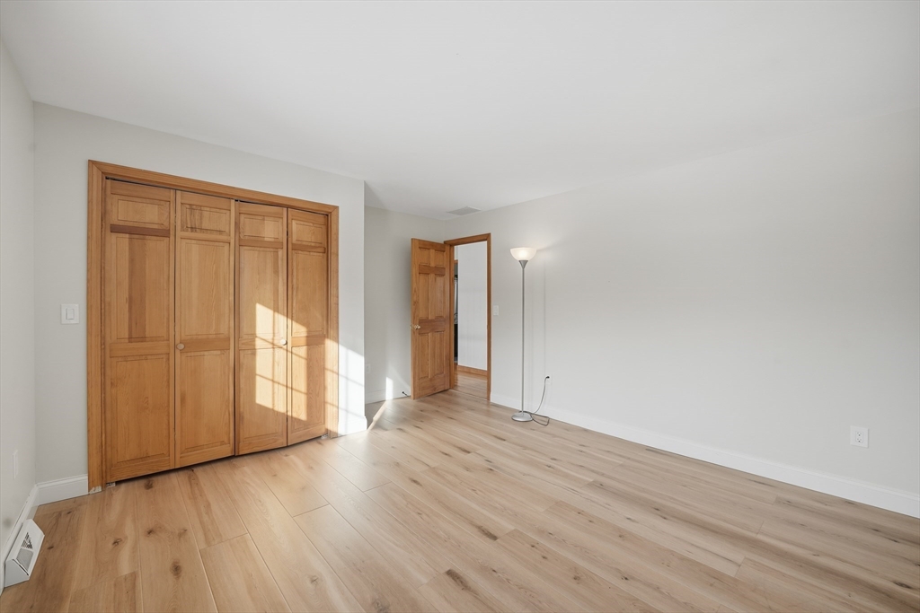 37 Wyndermere Place Ludlow, MA 01056 - Photo 26 of 42 a view of an empty room with wooden floor and a window