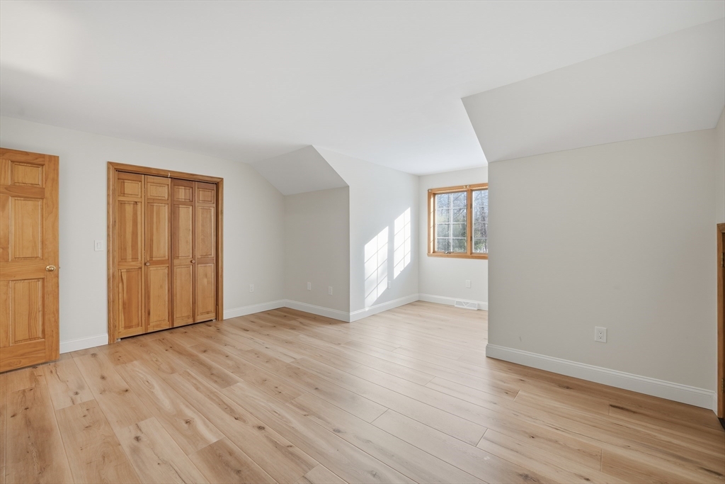 37 Wyndermere Place Ludlow, MA 01056 - Photo 30 of 42 an empty room with wooden floor and windows