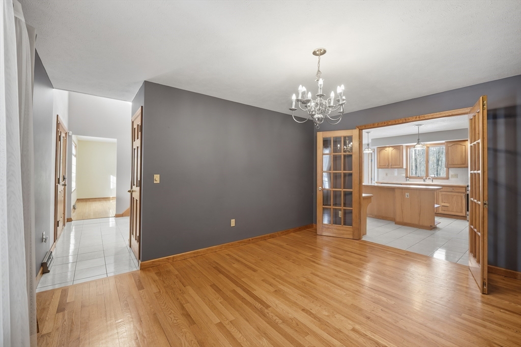 37 Wyndermere Place Ludlow, MA 01056 - Photo 9 of 42 wooden floor in an empty room with a window